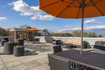 Rooftop terrace with grilling area at Clayborne Apartments, Alexandria